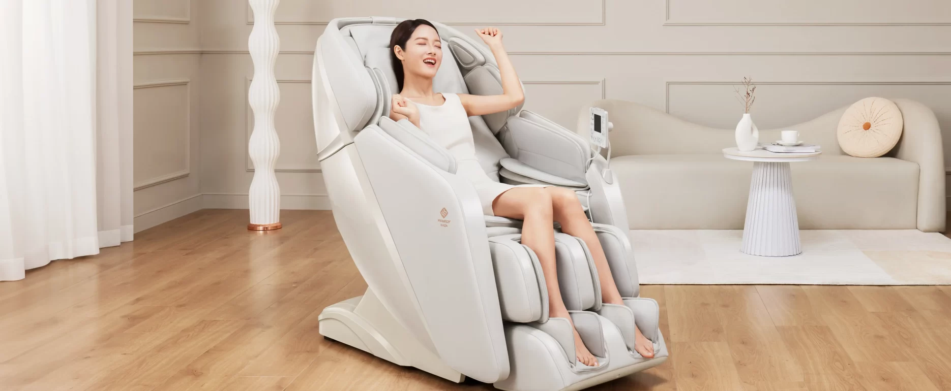 White Inada iFIT PRO massage chair showcasing its sleek design and ergonomic comfort features for full-body relaxation.