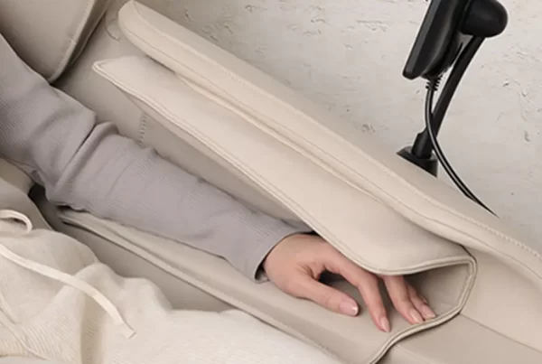 Inada iFIT massage chair providing arm massage with air cushions and rollers for enhanced comfort