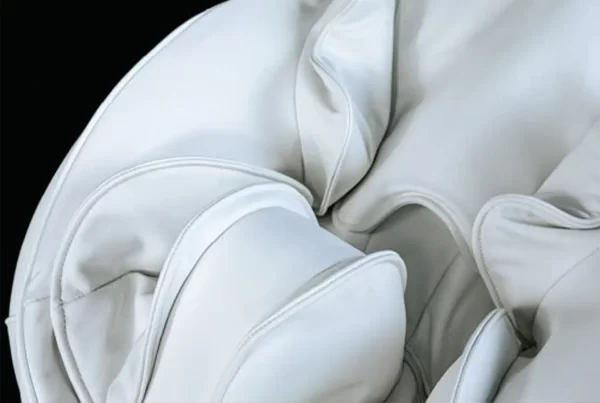 Close-up of iCOCOON massage chair air cushions inflating and deflating to provide gentle body support and relaxation